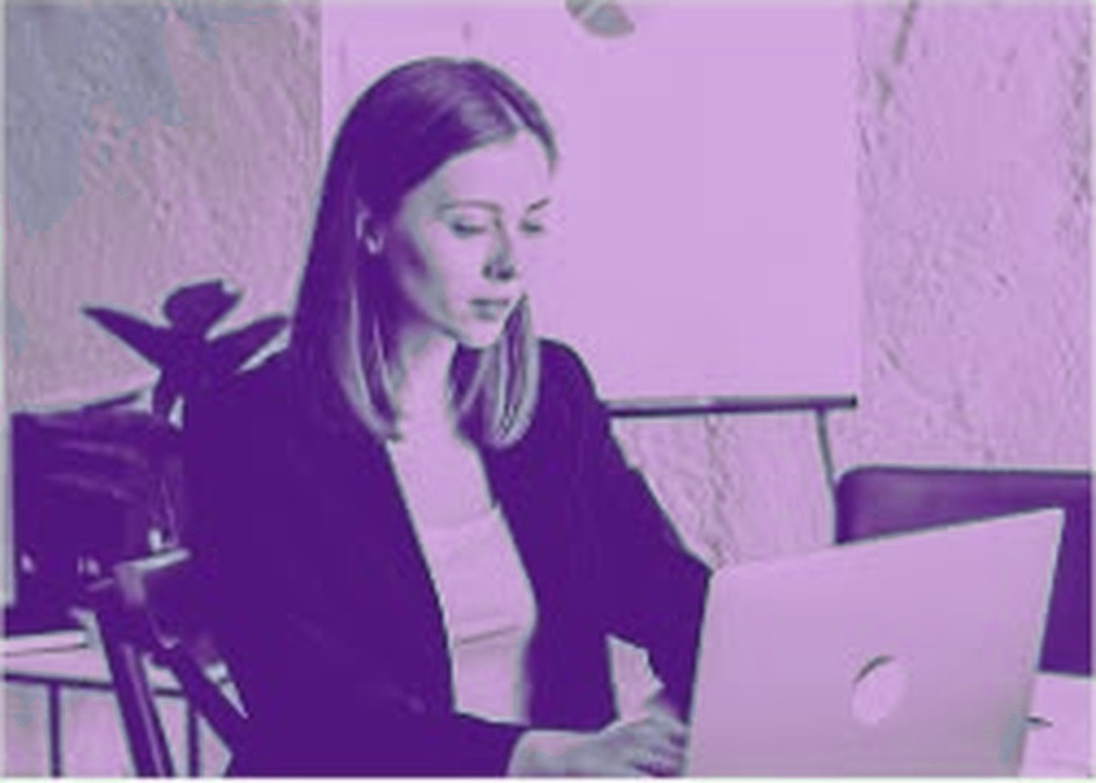 A frustrated learner at a laptop, tired of confusing trading courses